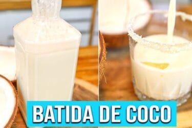Batida de Coco cremosa em copo com gelo, coco ralado e pedaços de coco.